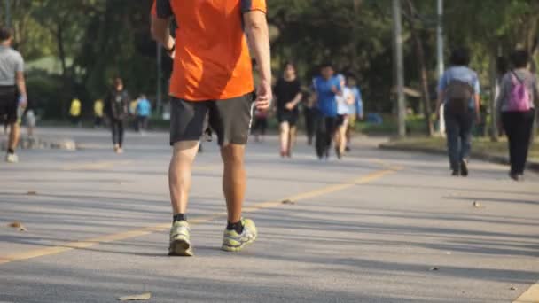 People are jogging in the park early morning in Bangkok.Thailand — Stock Video