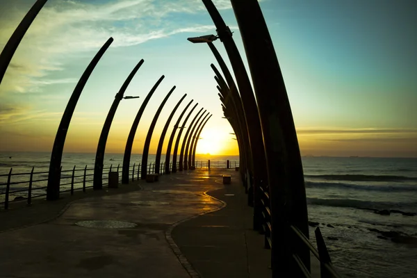 Durban pier umhlanga im sonnenaufgang lizenzfreie Stockbilder