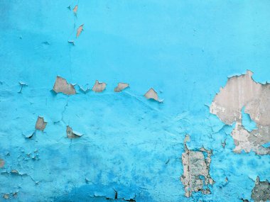 Arkasında grunge beton dokusu olan sarı boyalı bir duvar.