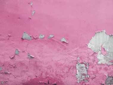 Arkasında grunge beton dokusu olan sarı boyalı bir duvar.