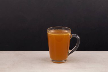 Homemade beef bone broth with natural collagen. Bouillon in transparent mug. Selective focus, copy space. clipart