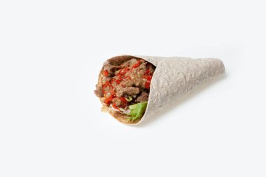 Et ve sebzeli Shawarma ya da arka planda fotokopi alanı olan kebap sandviçi..