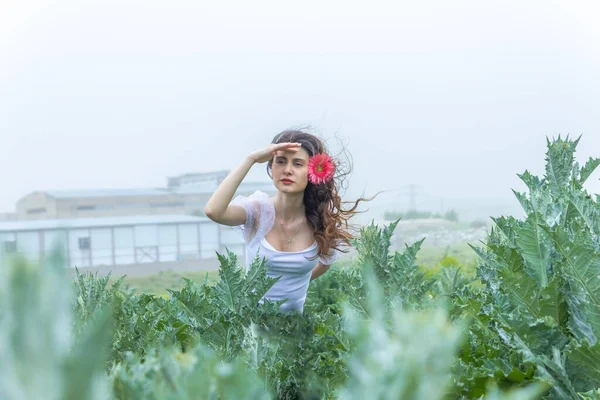 portrait of a woman with flower, portrait of a pretty woman in the garden