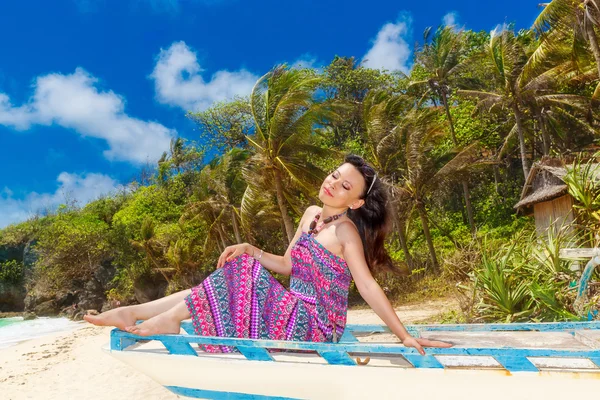 Young beautiful Asian  girl in blue dress on the beach of a trop — Stock Photo, Image