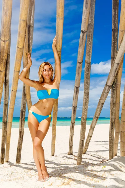 Happy beautiful young girl in bikini having fun on a tropical be — Stock Photo, Image
