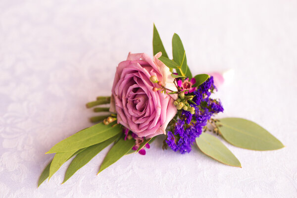 Purple rose boutonniere for the groom. Vintage