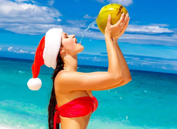 Young beautiful woman with long black hair in red bikini, dresse — Stock Photo, Image