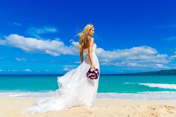 Beautiful blond fiancee in white wedding dress with big long whi — Stock Photo, Image