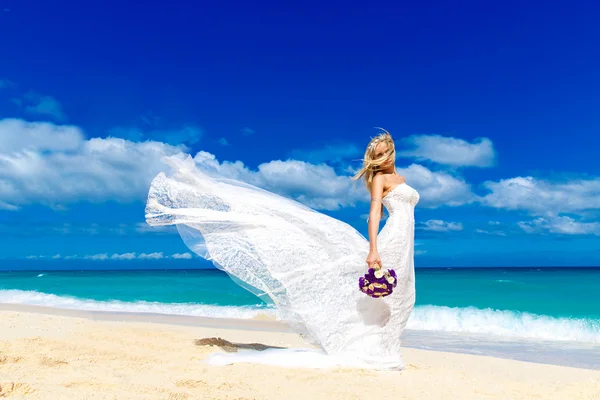Beautiful blond fiancee in white wedding dress with big long whi — Stock Photo, Image