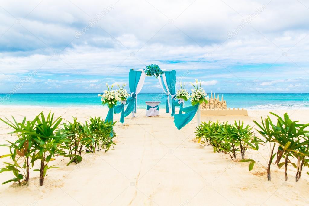 Wedding On The Beach Wedding Arch Decorated With Flowers On Tr Stock Photo Image By C Frolovaelena 65111285 https depositphotos com 65111285 stock photo wedding on the beach wedding html