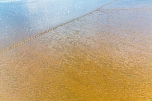 Strand zand achtergrond. — Stockfoto