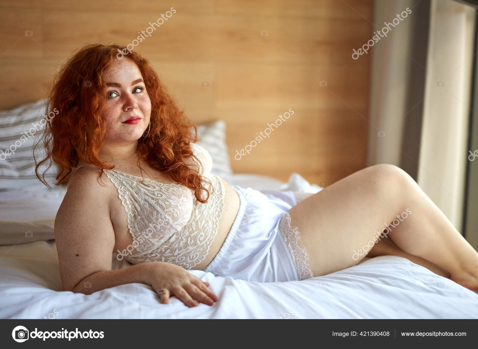 BBW overweight pretty caucasian woman showing off fat figure wearing sexy  lingerie Stock Photo by ©romanchazov27 421390408