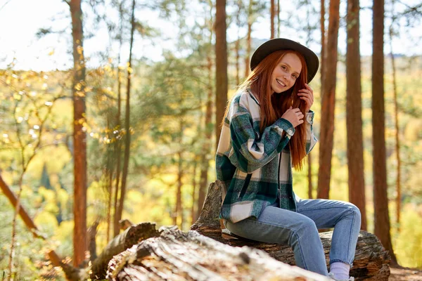 Attractive caucasian female with natural red hair relaxing in the forest — Stock Photo, Image