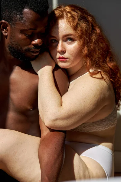 Multiracial couple in sensual erotic foreplay on bed at home — Stock Photo, Image