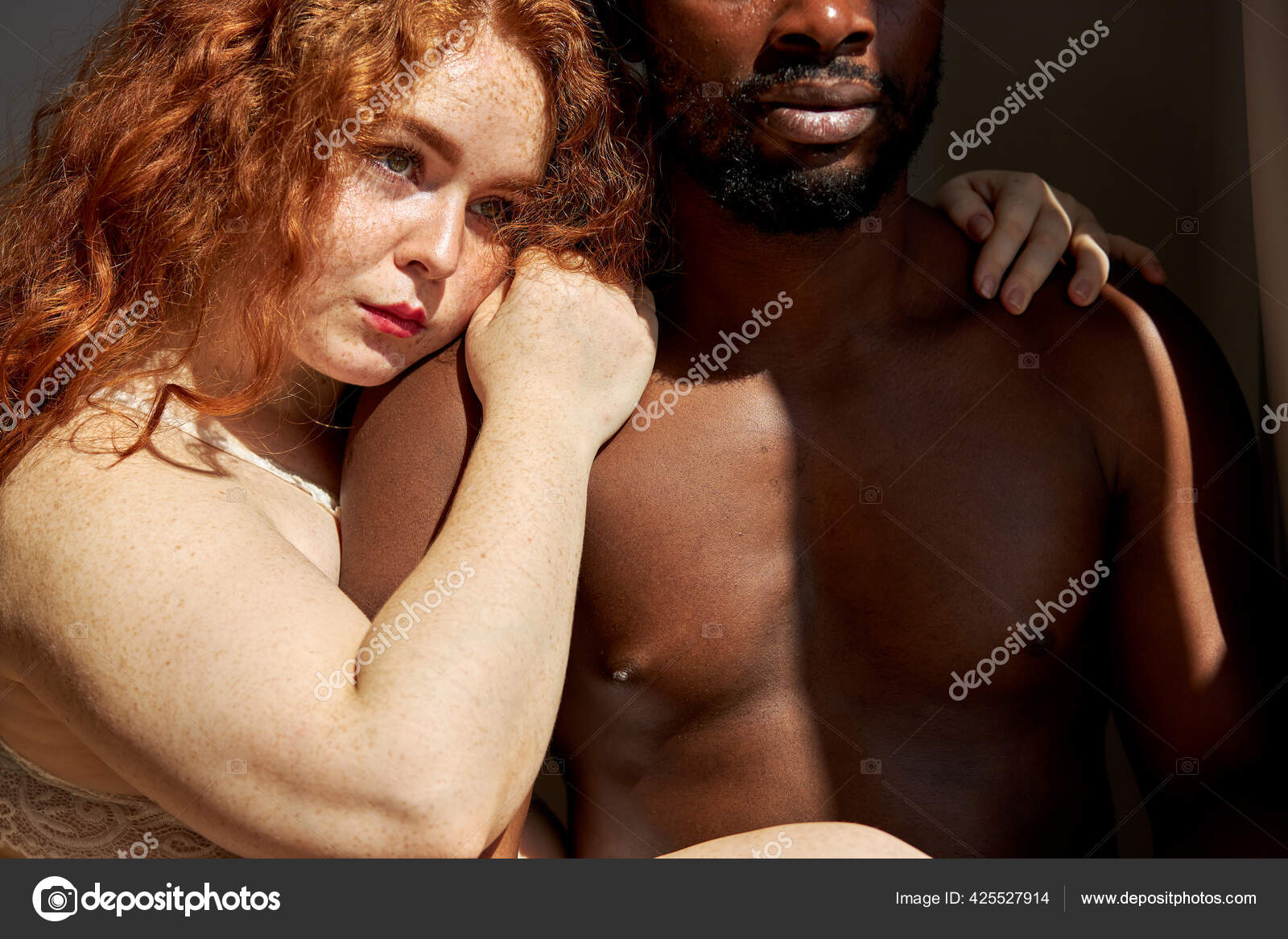 Passion between tender interracial diverse man and woman at home Stock Photo by ©romanchazov27 425527914