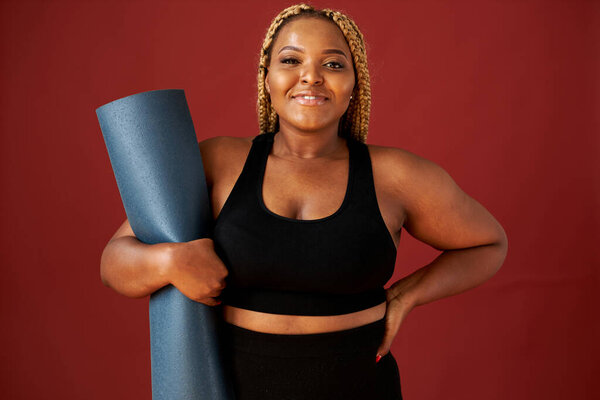 beautiful chubby african woman going to do sport exercises alone
