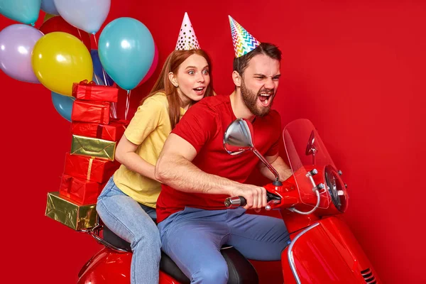 funny two people friends drive motorbike deliver gifts presents for birthday