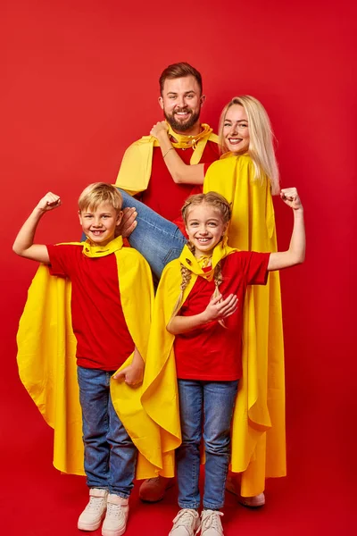 Strong children and parents superheroes isolated in studio — Stock Photo, Image