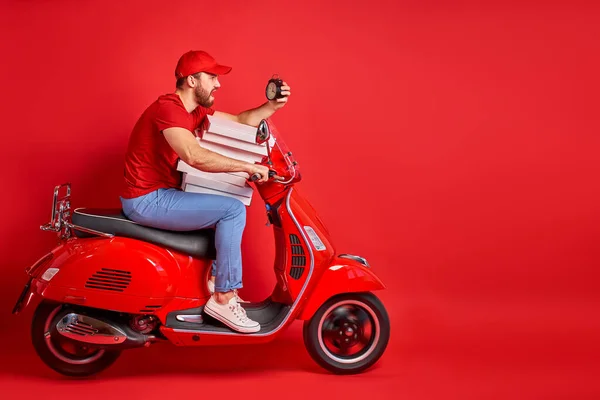 delivery courier man on scooter with driving fast to customers, holding orders