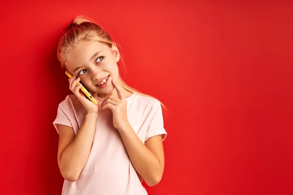 Sweet child girl talking with someone on phone — Foto de Stock