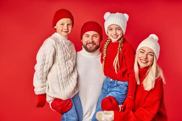Portrait of cheerful family with kids posing isolated in studio — Foto de Stock