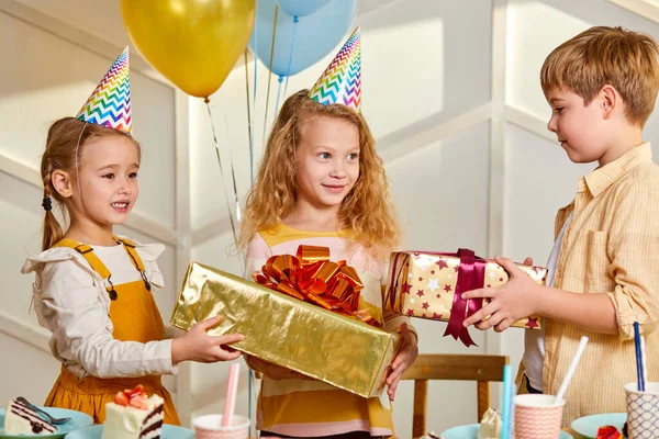 Adorable child girl getting gifts by friends — Stock Photo, Image