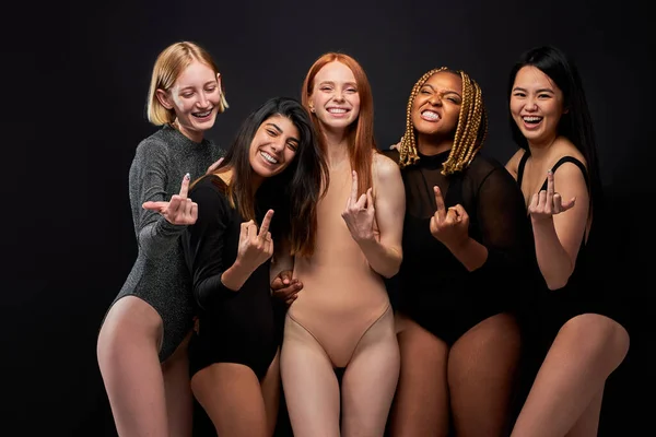 Crazy diverse women show fuck gesture at camera — 스톡 사진