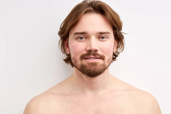 Close-up portrait of a sexy shirtless young man model with stylish haircut posing at camera — Stock Photo, Image