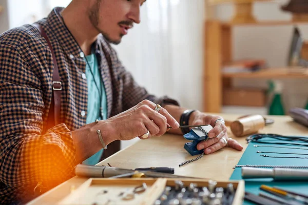 professional jewelry master is working to create jewelry