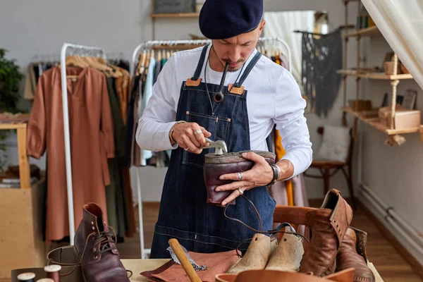 shoemaker workshop for making shows artisan handmade manufacturing leather shoes, restoration