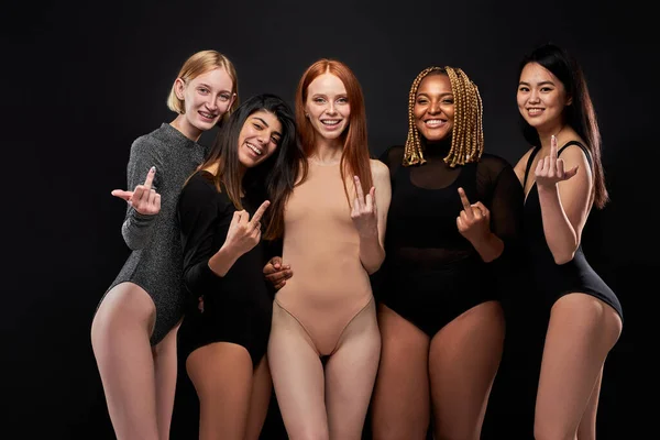 Crazy diverse women show fuck gesture at camera — Foto de Stock