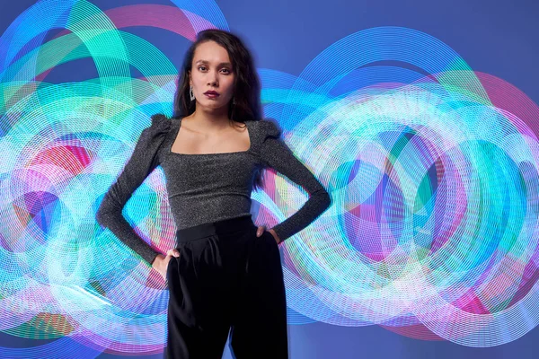 Photo of young caucasian model on a long exposure with the colourful light source — Stock Photo, Image