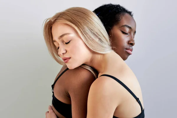 Two lgbt lovers, lesbians in sexy lingerie leaned on each other — Stock Photo, Image