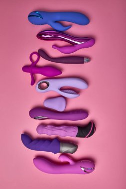 Colourful Dildo, vibrator in sex shop assortment. toys for adults, sensuality, excitement concept.