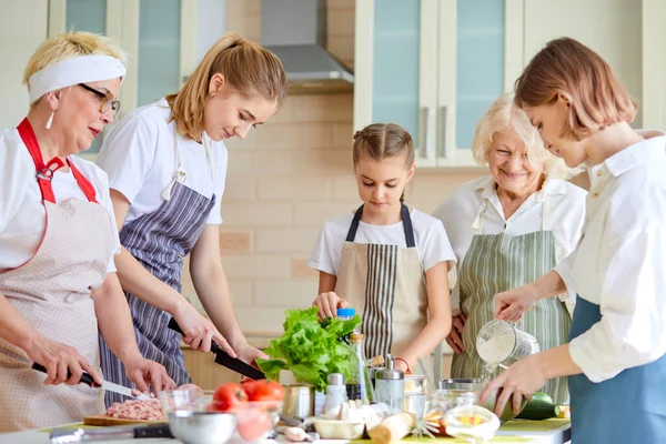 Healthy food at home. Caucasian family in bright modern kitchen at home