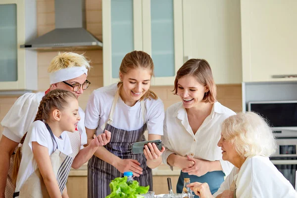 Cheerful Family Grandmothers And Children Have Fun, Watching Video While Cooking — Stock Photo, Image