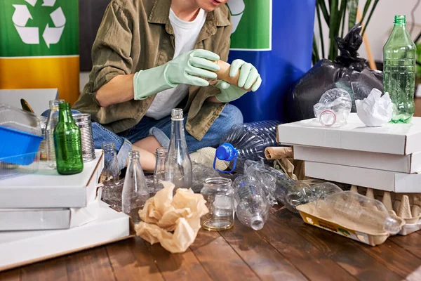 Cropped Woman sorting different waste. Sorting waste paper, glass, plastic into box — Fotografia de Stock