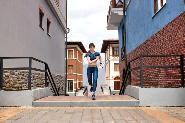 Running woman. Runner jogging in city, training outside alone, fitness woman in sportswear — Stock Photo, Image