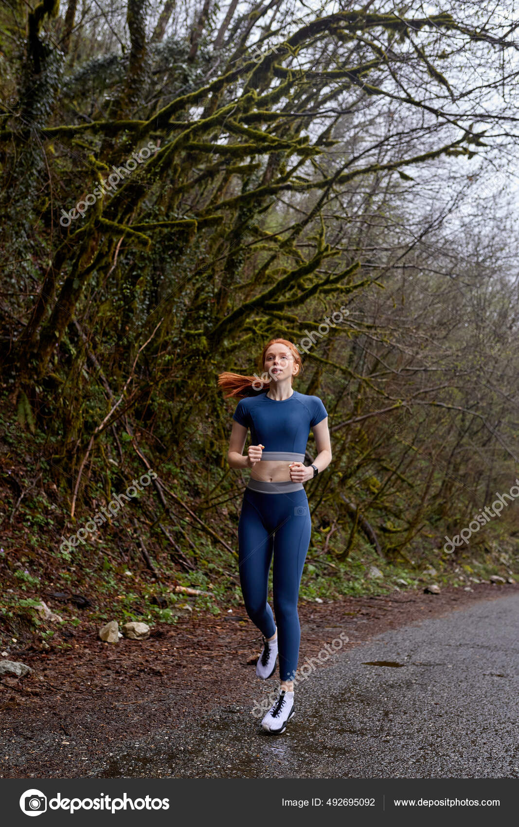 Running woman.Redhead Female Runner Jogging during Outdoor Workout