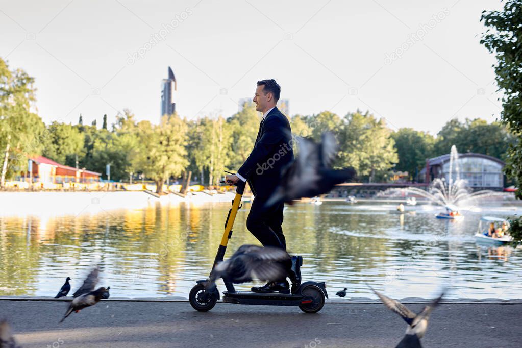 businessman riding electro scooter on river lake background, rental transportation.