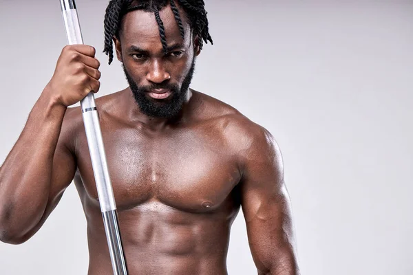 Confident bearded african muscular Man with barbell weight, sport equipment — Stock Photo, Image