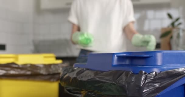 Female passes plastic bottles to the reception point for garbage and sorted waste — Stock Video