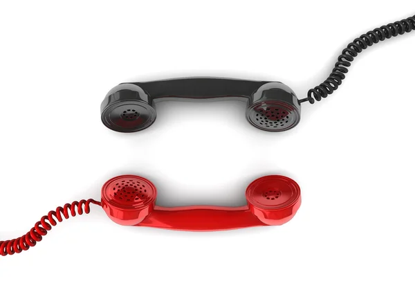 Two handsets lie opposite each other — Stock Photo, Image