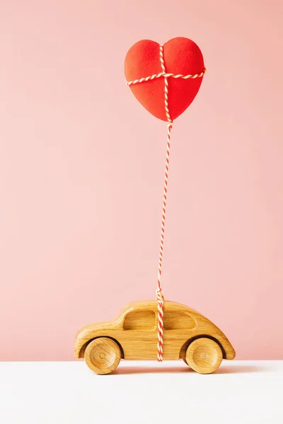 Wooden Toy Car Carrying Heart Shape Balloon — Stock Photo, Image