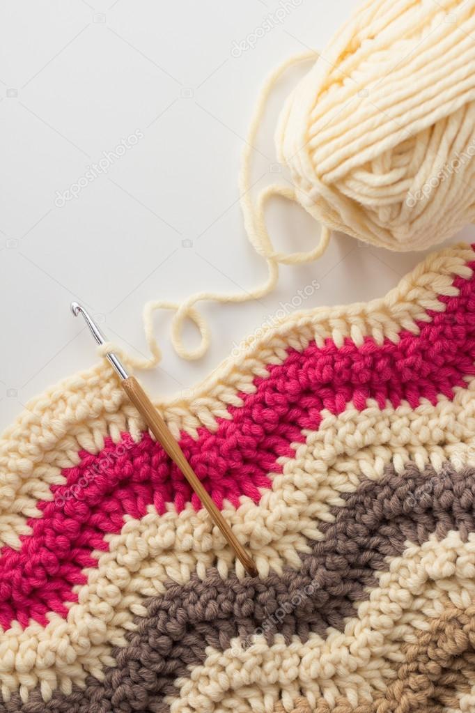 Crochet hook with crocheted blanket — Stock Photo © Melica 52960403