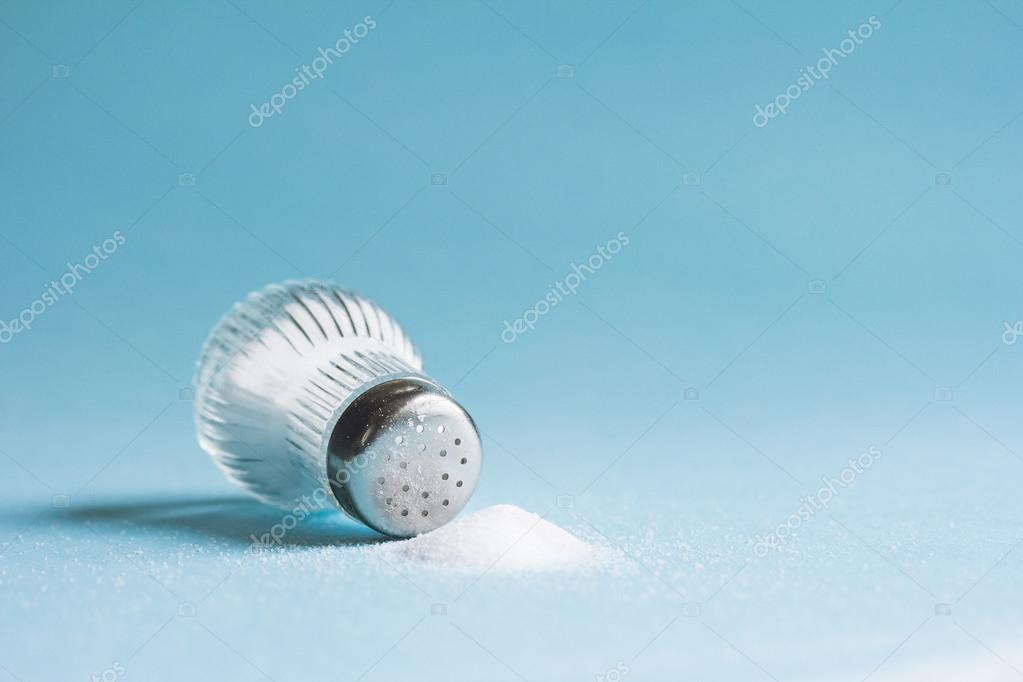 Light bulb and salt shaker Stock Photo