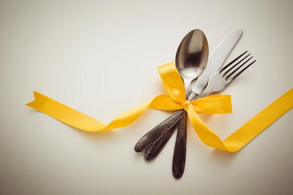 Cutlery with decorative ribbon — Stock Photo, Image