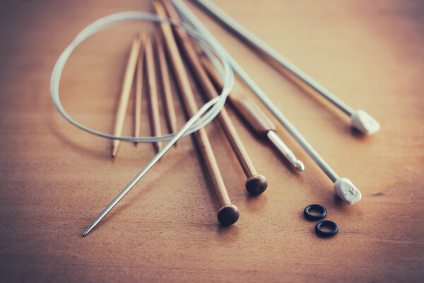 Knitting set on wooden table