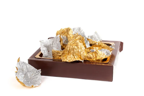 Box and wrappers from candies — Stock Photo, Image