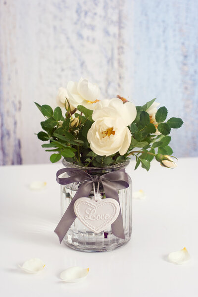 White roses in vase